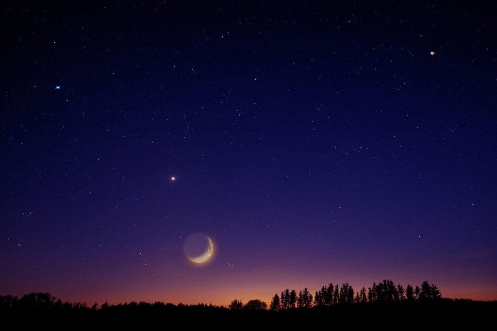 The night sky with the heavens, stars, and the moon.