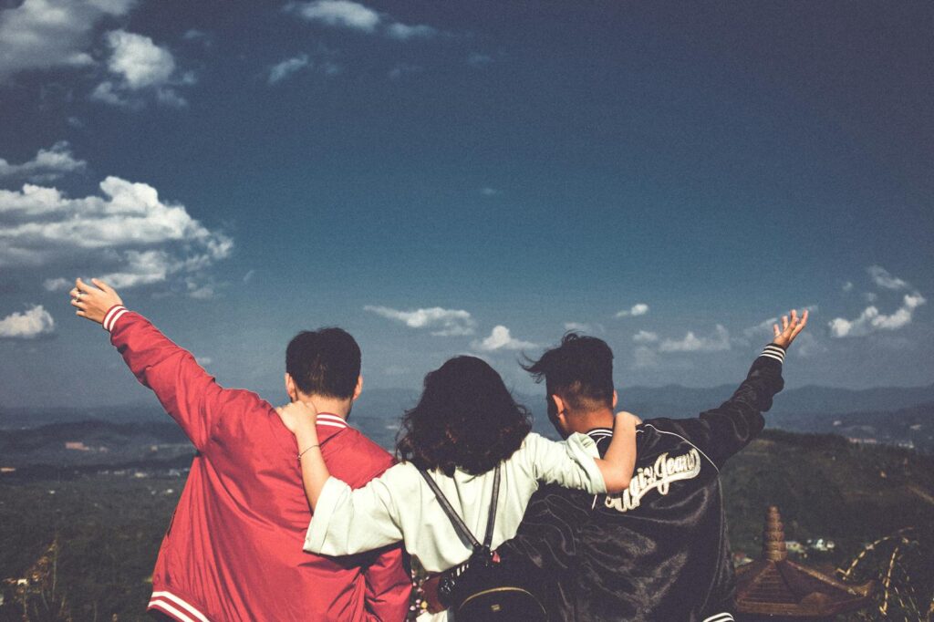 A joyful moment with friends overlooking a scenic landscape in Gia Lai, Vietnam.