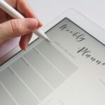 A stylus writing in a digital weekly planner on a tablet screen is ideal for organization.