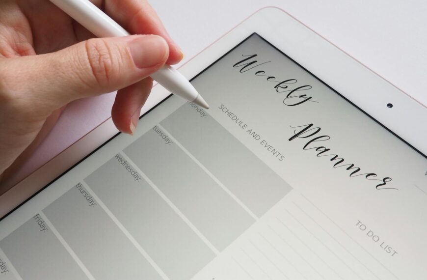 A stylus writing in a digital weekly planner on a tablet screen is ideal for organization.